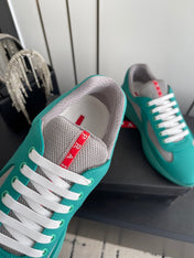 PRADA 26S AMERICA CUP SNEAKERS IN TEAL BLUE SOFT RUBBER AND BIKE FABRIC