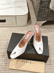ALAIA SPIKE JEWEL MULES IN WHITE CALFSKIN