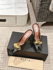 ALAIA SPIKE JEWEL MULES IN BLACK CALFSKIN WITH GOLD HARDWARE