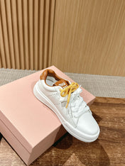 MM SNEAKERS IN WHITE CALFSKIN WITH YELLOW LACES
