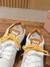 MM SNEAKERS IN WHITE CALFSKIN WITH YELLOW LACES