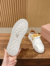 MM SNEAKERS IN WHITE CALFSKIN WITH YELLOW LACES