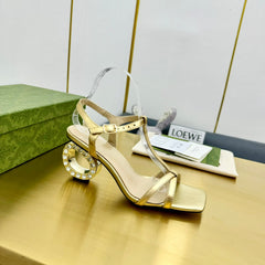 MEDIUM-HEEL SANDAL IN GOLD CALFSKIN GOLD HARDWARE WITH RHINSTONES