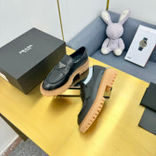 LOAFER WITH TRIANGLE LOGO IN BLACK CALFSKIN