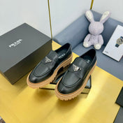 LOAFER WITH TRIANGLE LOGO IN BLACK CALFSKIN