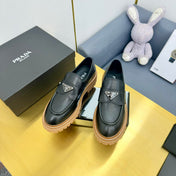 LOAFER WITH TRIANGLE LOGO IN BLACK CALFSKIN