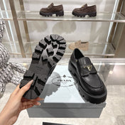 PRADA 25S THICK-SOLE LOAFERS 60 MM IN BLACK SMOOTH CALFSKIN