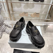 PRADA 25S THICK-SOLE LOAFERS 60 MM IN BLACK SMOOTH CALFSKIN