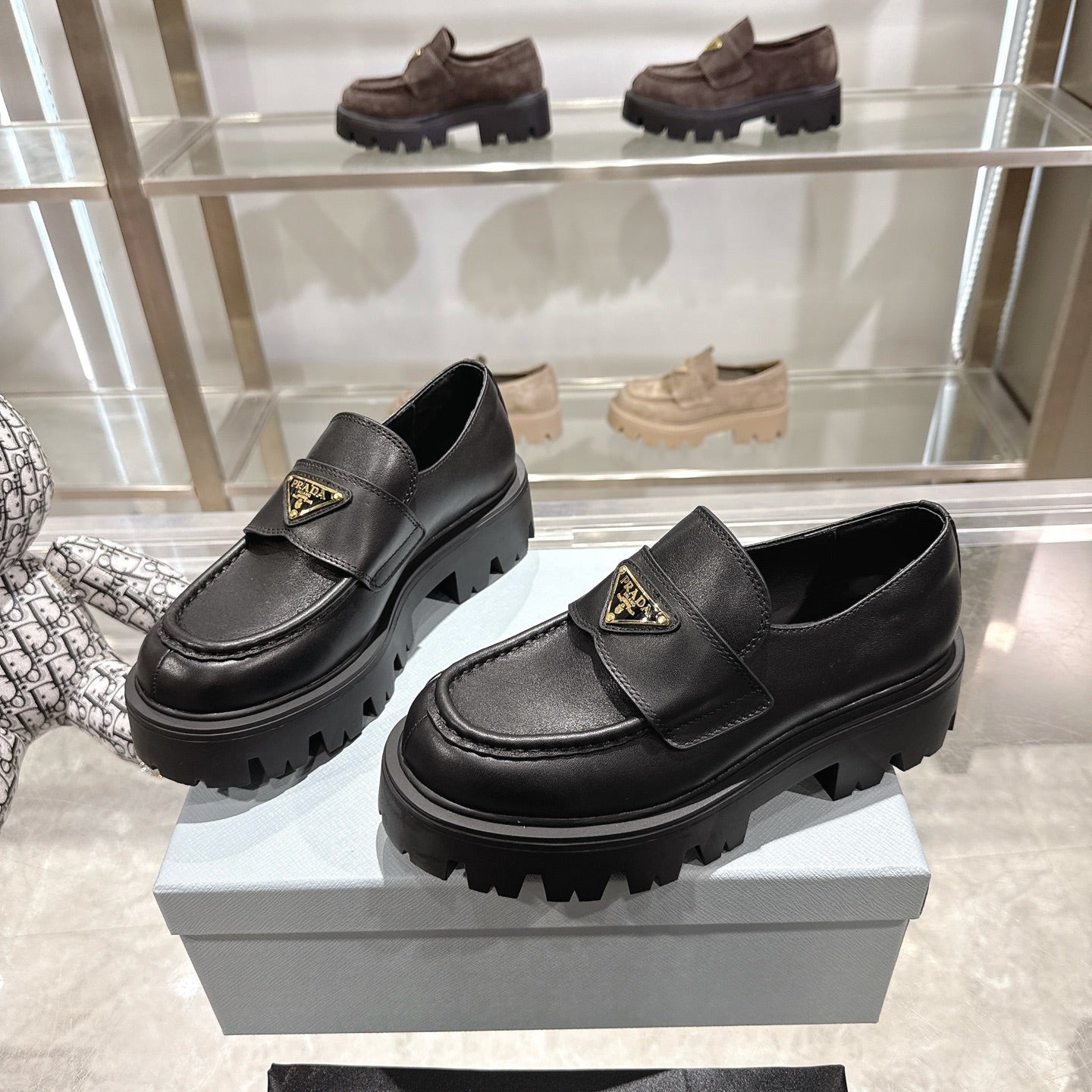 PRADA 25S THICK-SOLE LOAFERS 60 MM IN BLACK SMOOTH CALFSKIN