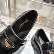 PRADA 25S THICK-SOLE LOAFERS 60 MM IN BLACK CALFSKIN