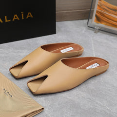 ALAIA FLAT MULE IN SEPIA TAN LAMBSKIN