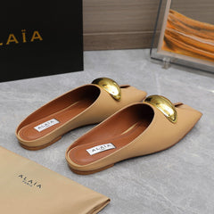 ALAIA FLAT MULE IN SEPIA TAN LAMBSKIN WITH GOLD HARDWARE