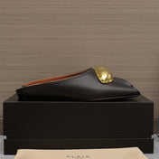 ALAIA FLAT MULE IN BLACK LAMBSKIN WITH GOLD HARDWARE
