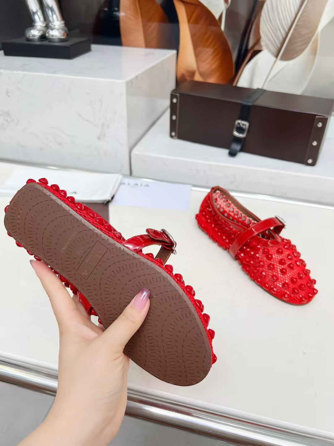 ALAIA MARY JANE SHOES IN CHERRY RED STUDDED FISHNET MESH AND CALFSKIN