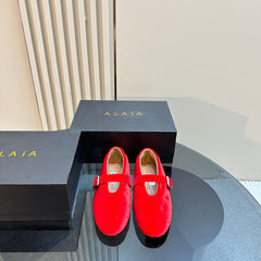 ALAIA BALLET FLATS IN CHERRY RED VELVET