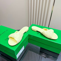 BLINK FLAT MULE IN PASTEL YELLOW INTRECCIATO LEATHER