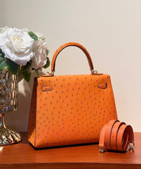 KELLY SELLIER 25 BAG IN FIRE ORANGE OSTRICH LEATHER WITH GOLD HARDWARE