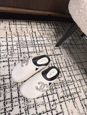 FLAT MULES IN WHITE CALFSKIN