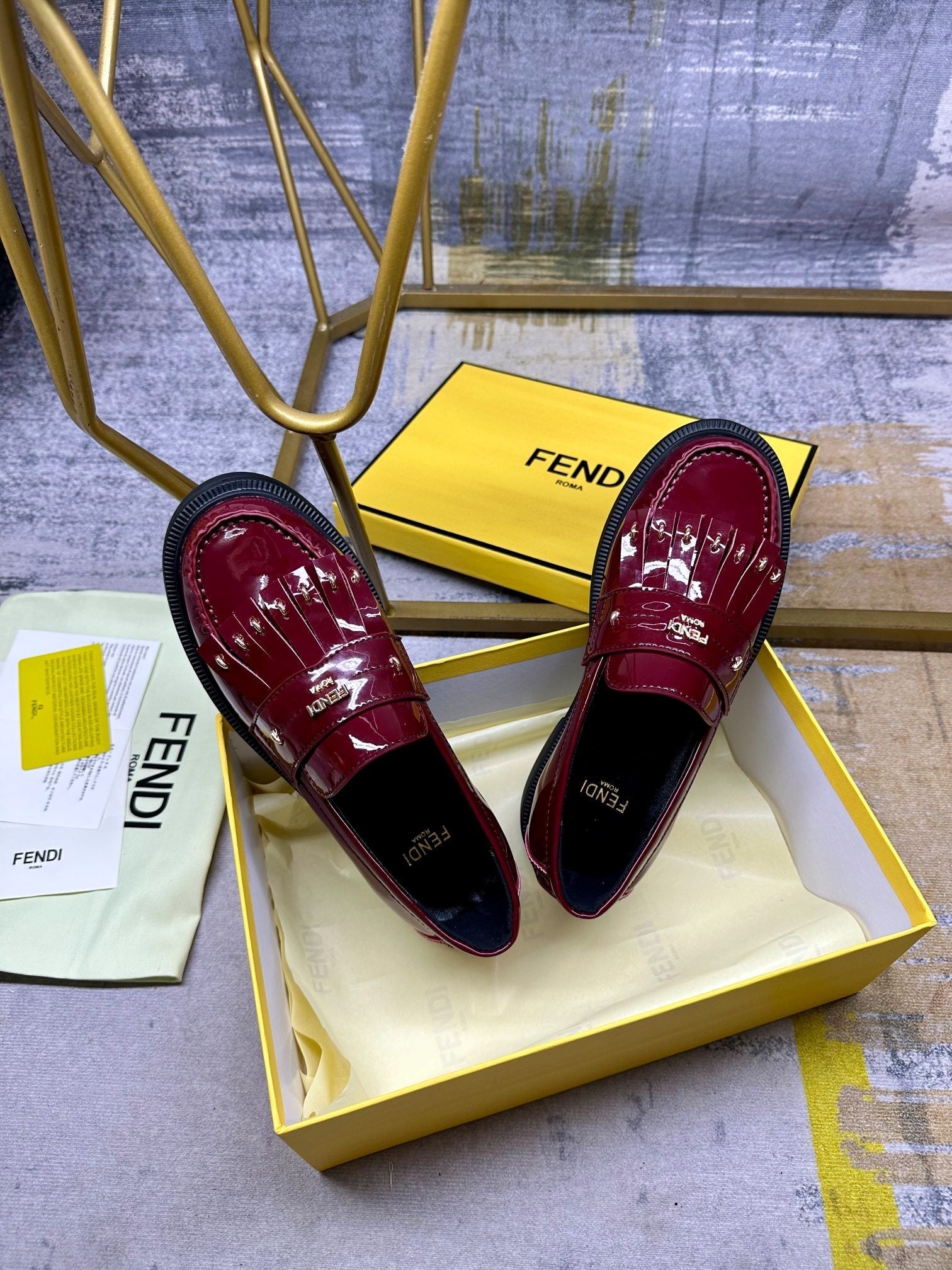 FENDI BAGUETTE LOAFERS IN MAROON RED CALFSKIN WITH GOLD HARDWARE