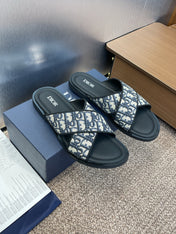 DIOR 25S ALIAS CROSS-STRAP SLIDES IN BLACK CALFSKIN WITH CD OBLIQUE DEEP BLUE LOGO