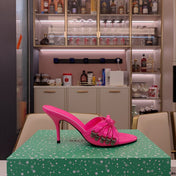 BOW-EMBELLISHED HIGH MULES IN HOT PINK SHEEPSKIN