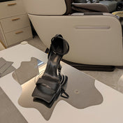 OPEN-TOE CURVED HIGH HEEL SANDALS IN BLACK SMOOTH CALFSKIN