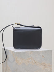 NIKI BABY 22 IN CHARCOAL GRAY CALFSKIN GOLD LOGO