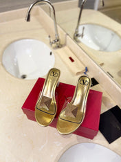 HIGH MULE 60MM IN GOLD SHEEPSKIN AND TRANSPARENT PVC
