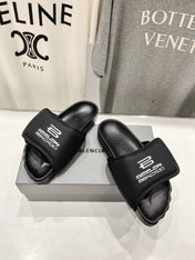 SLIDE SANDALS IN BLACK NYLON AND RUBBER WHITE PRINT