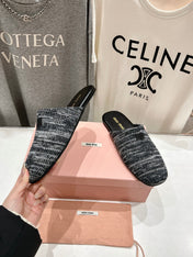 KNITTED MULES IN BLACK MIX WHITE WOOL