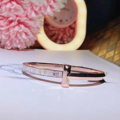 WIDE HINGED BANGLE PINK GOLD WITH BAGUETTE DIAMONDS